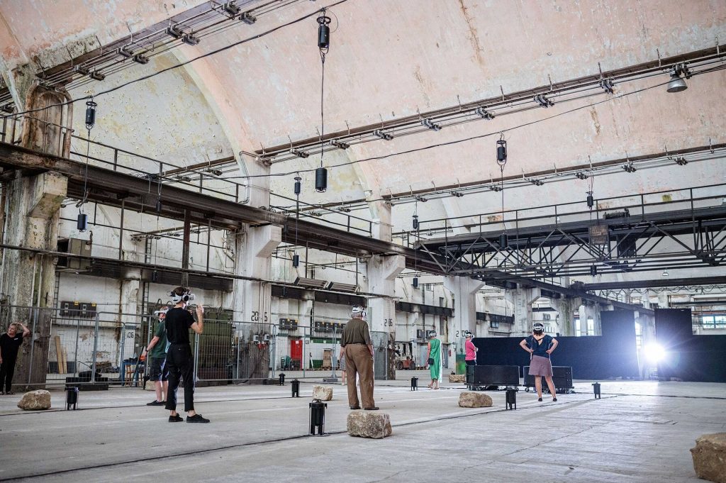 People with VR headsets in a warehouse